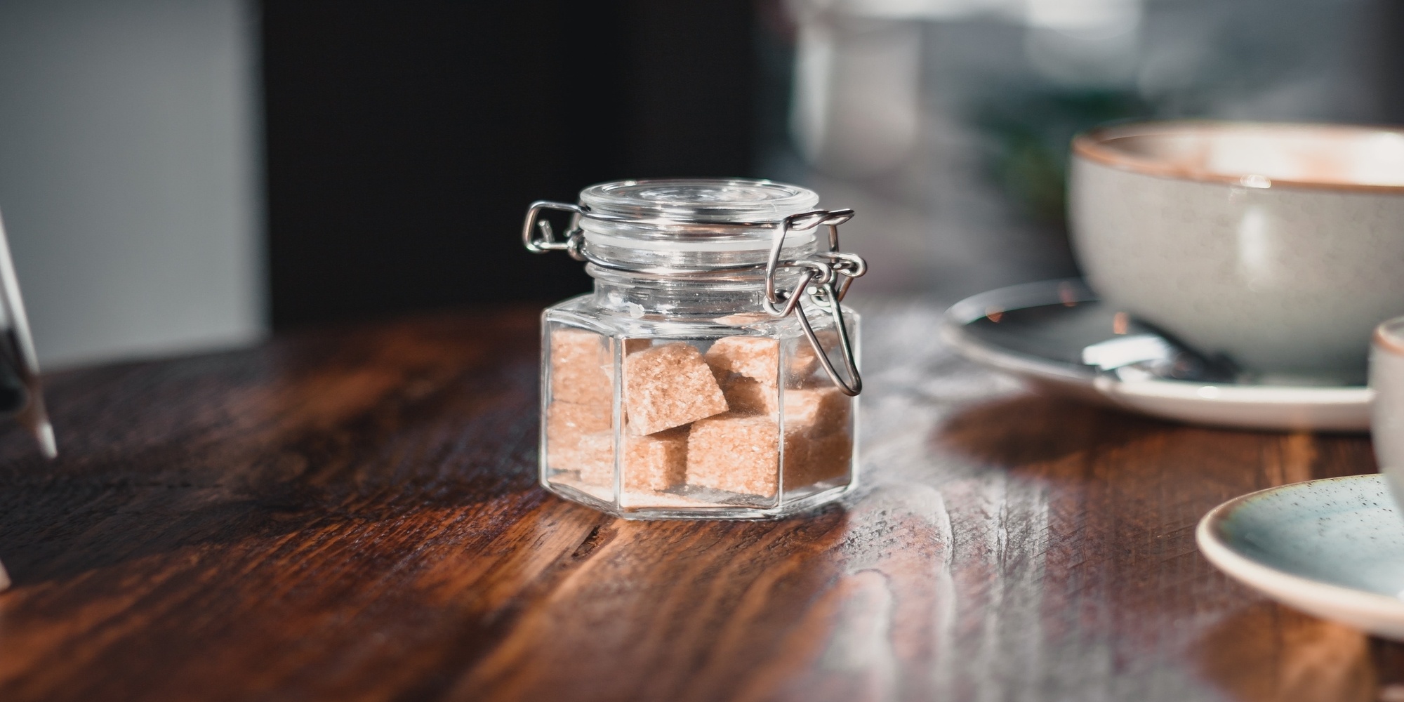 jar on taable with brown sugar cubes inside