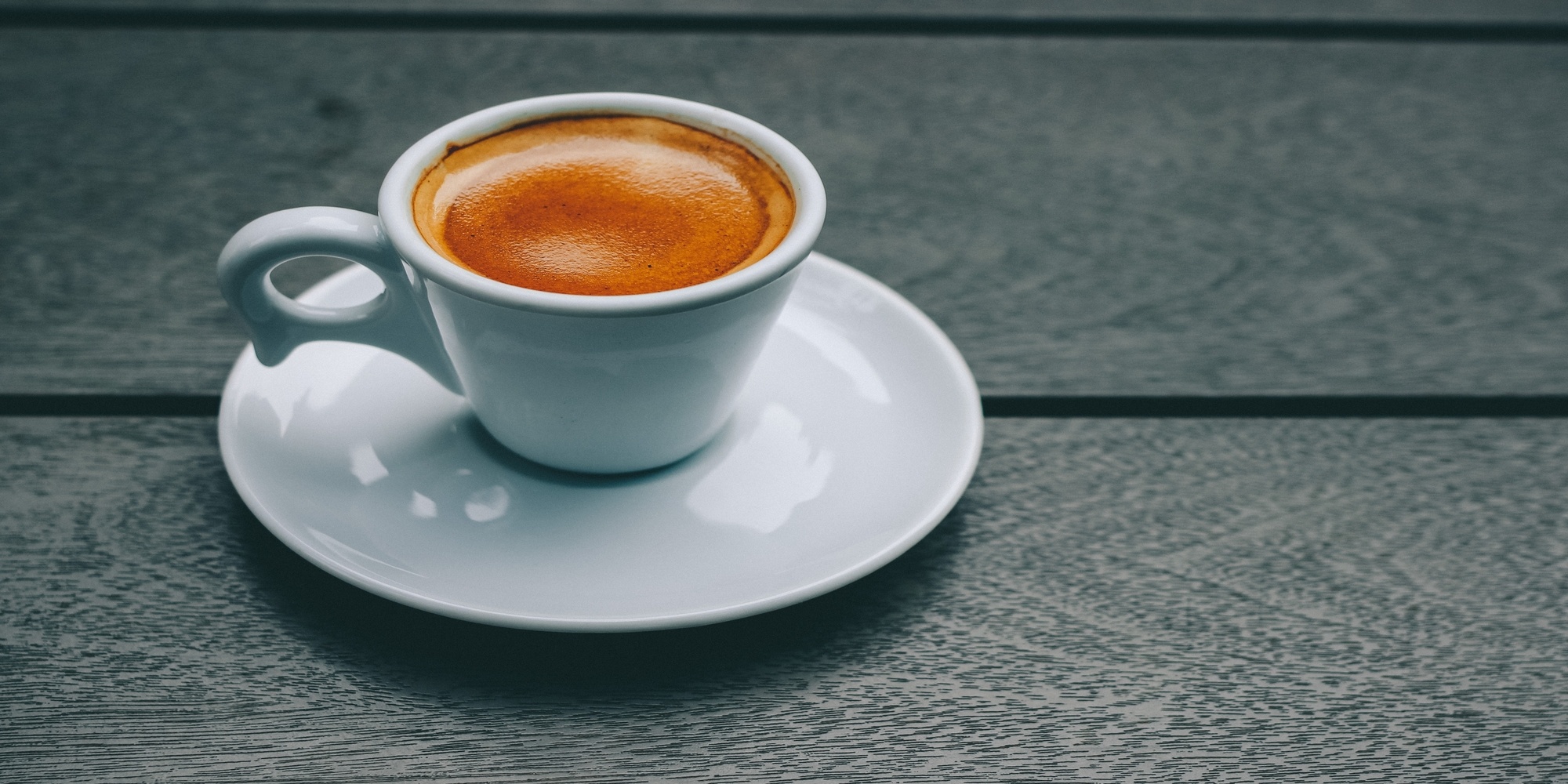 Double brew espresso in white cup and saucer