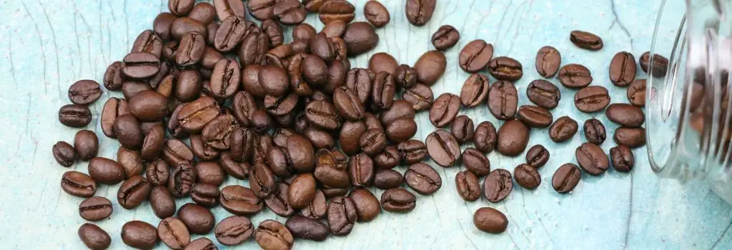 whole coffee beans spread over table