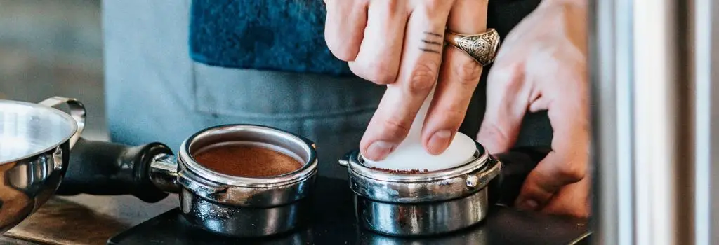 tamping coffee, pull a perfect shot of espresso