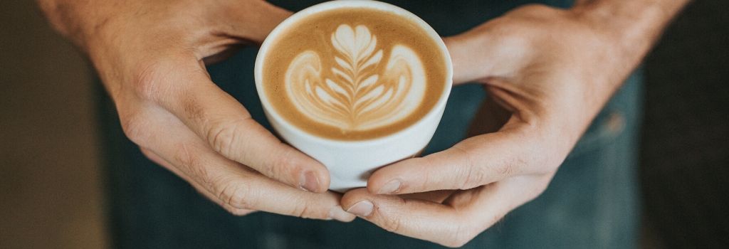 Man holding latte coffee