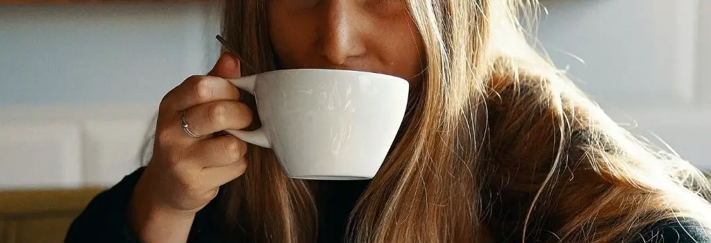 lady tasting coffee