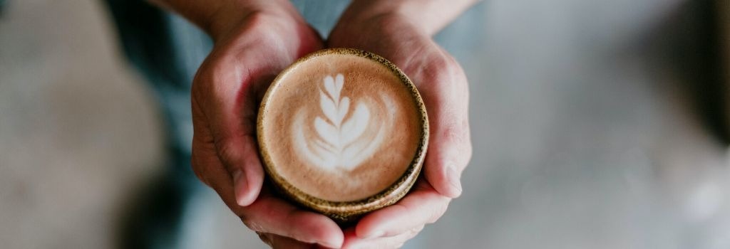 Person holding coffee