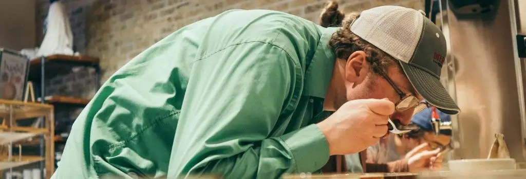 person taking part in coffee cupping session