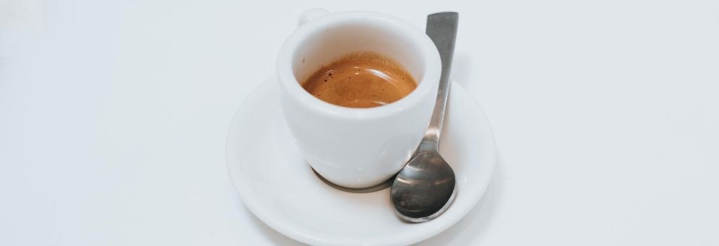 espresso shot in white espresso cup